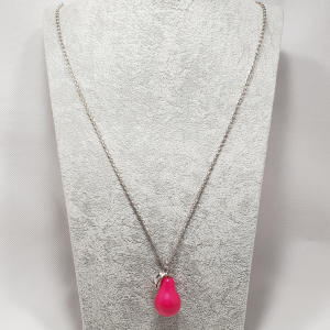 Women's pink pear drop pendant on silver tone link chain.